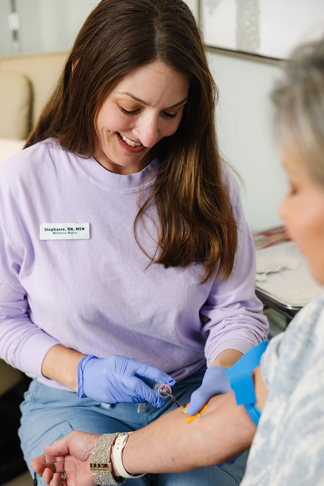 a nurse and a menopausal woman having blood drawn for a full hormone panel in Chapel Hill
