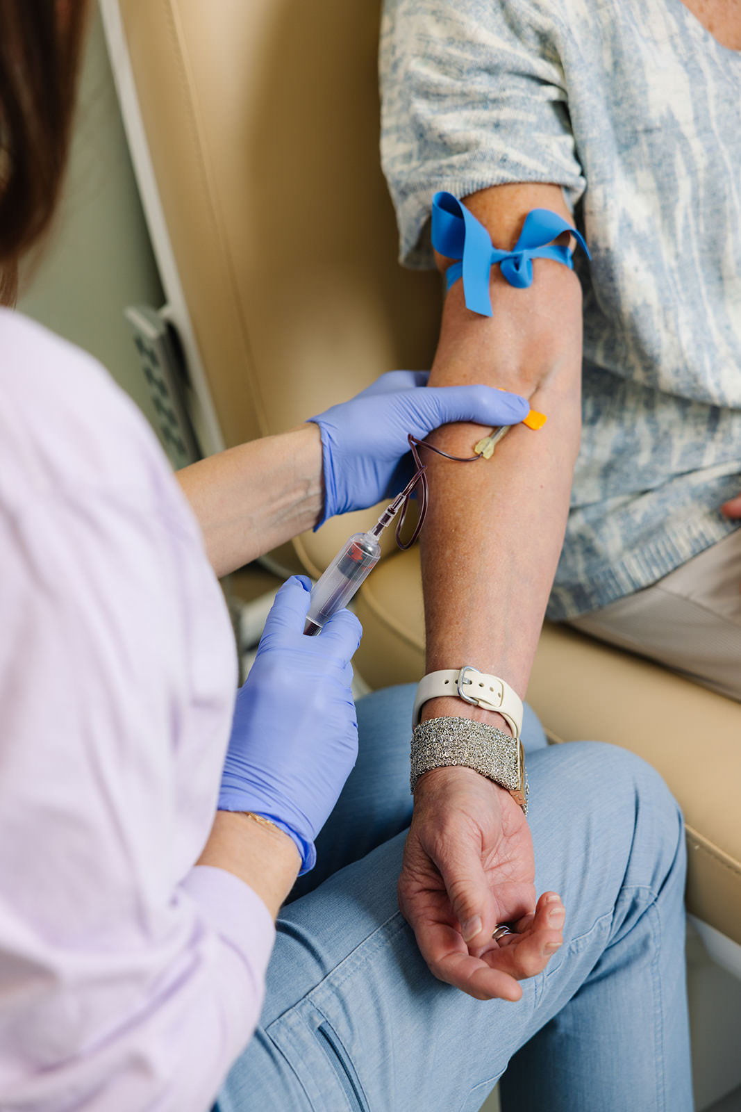a menopausal woman having blood drawn for a full hormone panel in Chapel Hill
